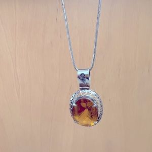 Silver necklace with large yellow topaz stone pendant